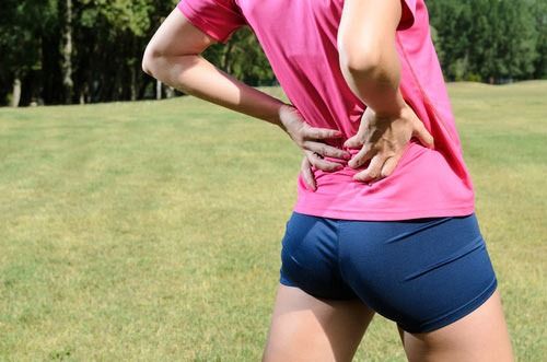 Какво означава болката в долната част на гърба преди менструацията?