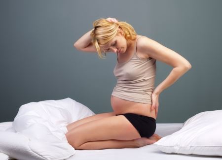Причините и диагностицирането на болката в кокцикса по време на бременност
