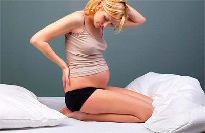 Болка в гърба по време на бременност какво да правя