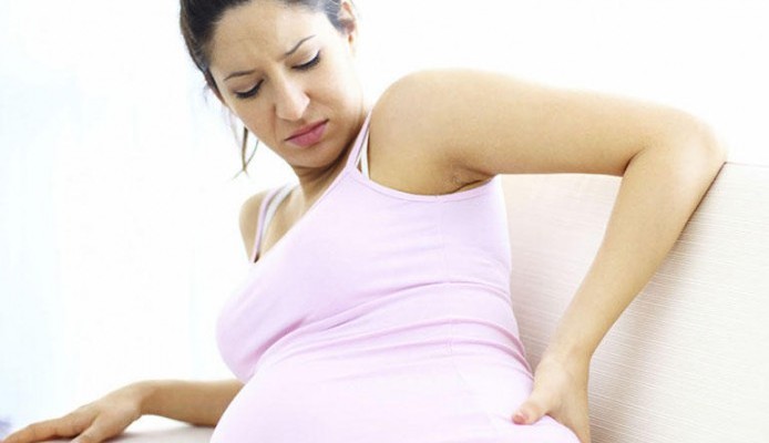 Защо по време на бременността болката при краката е болна?